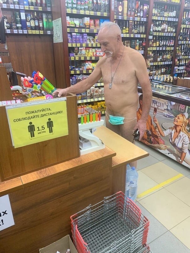 a man is standing in front of a store counter